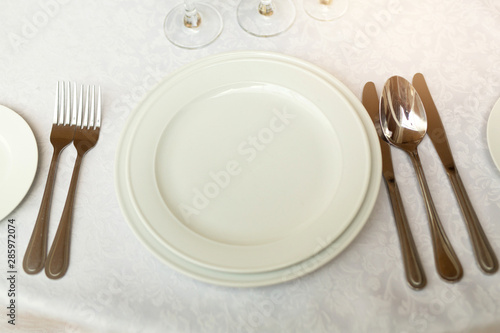 tableware standing on a white festive table