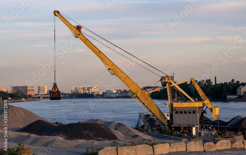 Crane vessel unloads building material