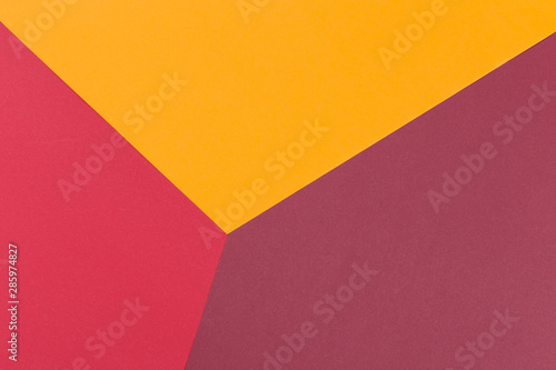 Paper yellow, burgundy, red empty background, geometrically located. Color blank for presentations, copy space.