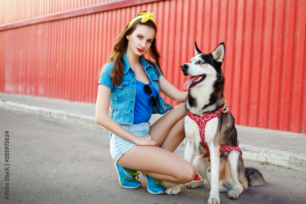Girl with her husky dog
