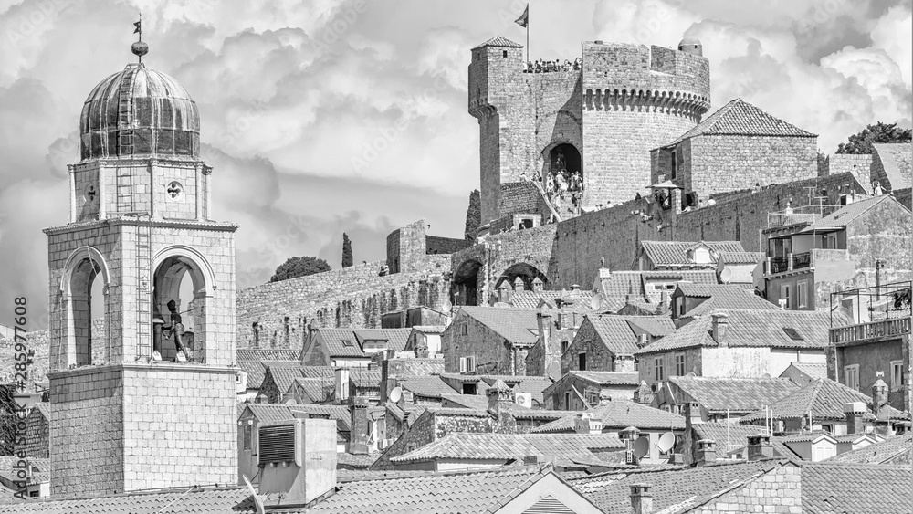 Mediterranean cityscape in black-and-white color - view of the roofs of the Old Town of Dubrovnik on the background on of the city walls and of the Minceta Tower, Adriatic coast of Croatia