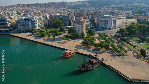 Aerial drone photo of famous tourist vintage ships sailing in Thermaikos water front sea in front of beautiful Thessaloniki or Salonica, North Greece  © aerial-drone