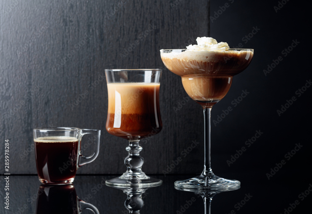 Coffee cocktails and espresso on black reflective background. Coffee cocktails and espresso on black reflective background.
