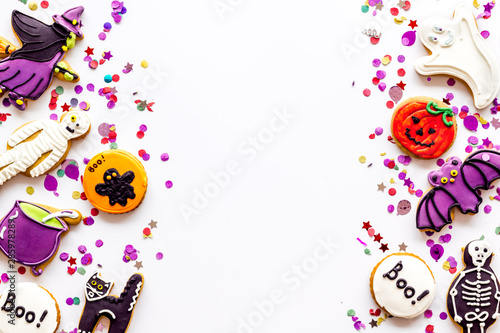 Halloween decorations frame on white background top view copyspace