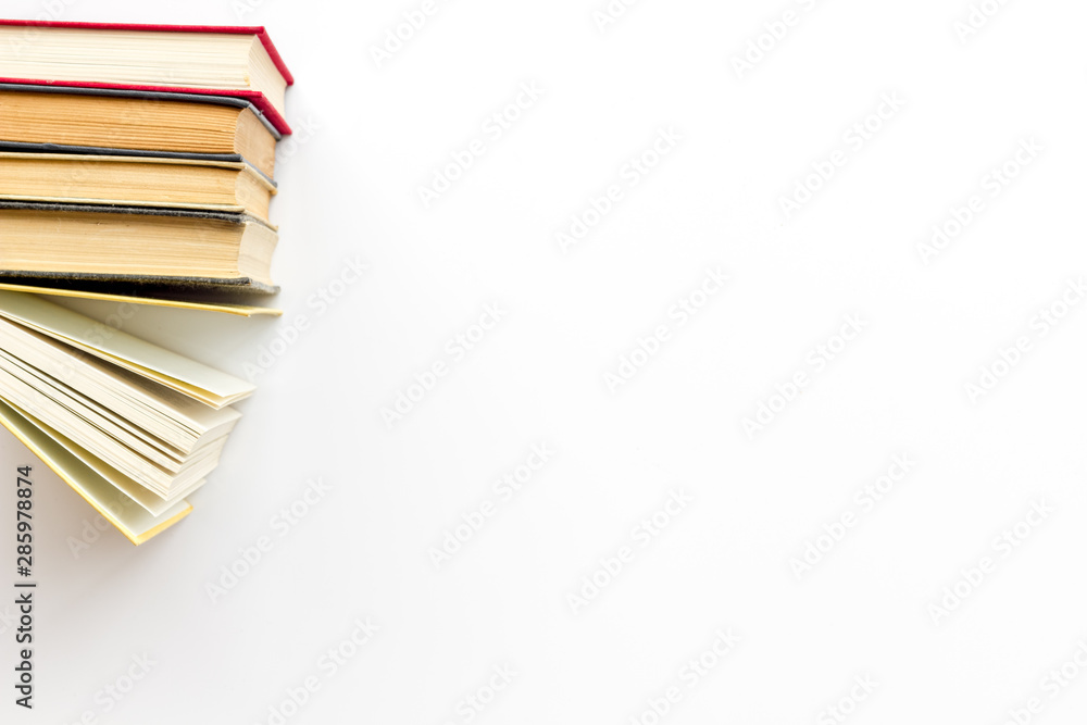 Books on library desk on white background top view space for text Books on library desk on white background top view space for text