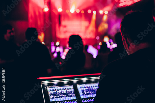 Professional sound engineer console at concert.