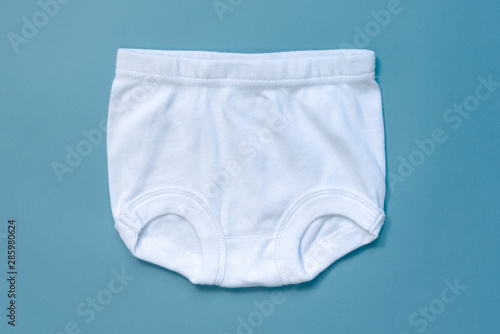 White baby panties on a blue background.