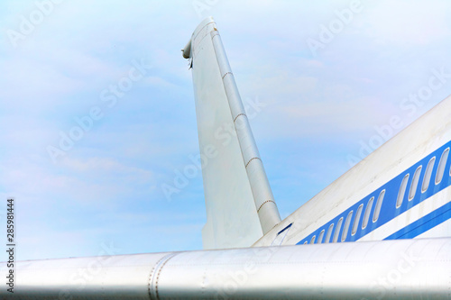 Elements of a passenger plane with a blue stripe closeup.