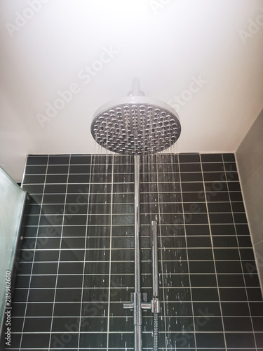 rain shower in a black and white bathroom
