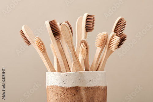 Wooden Eco Toothbrush in Brown Ceramic Cup. Zero waste 