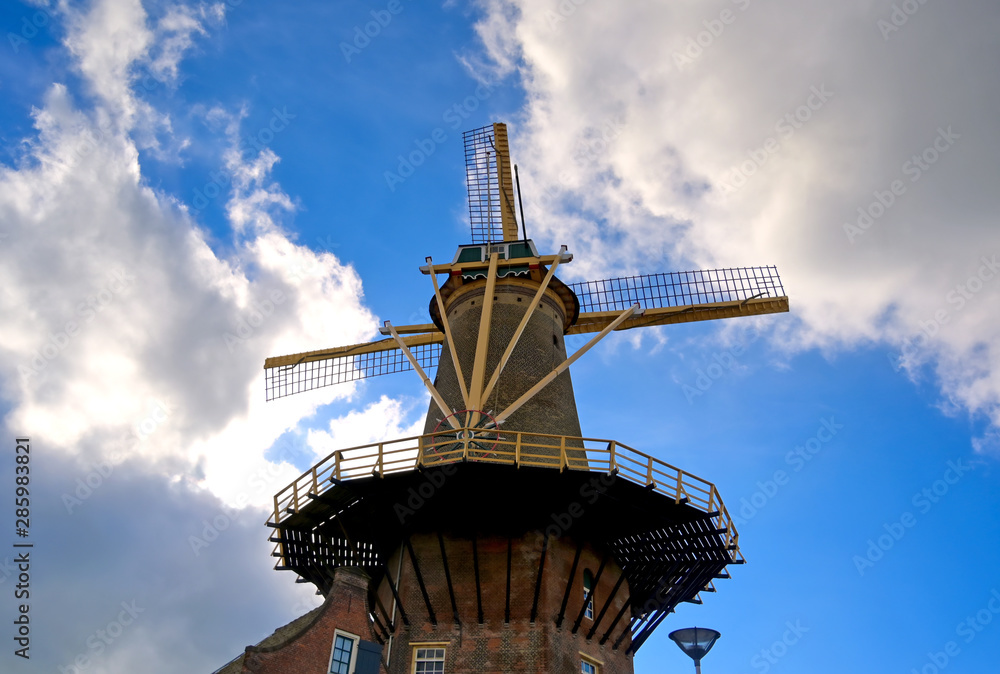 A windmill in the city of Delft in The Netherlands on a sunny day. A windmill in the city of Delft in The Netherlands on a sunny day.
