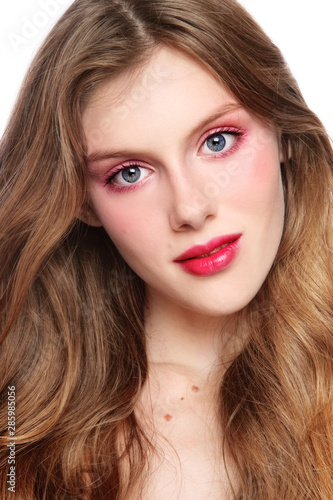 Vintage style portrait of young beautiful girl with long hair and fancy make-up