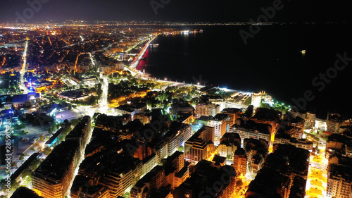 Aerial drone night shot of famous promenade area in new waterfront of Thessaloniki or Salonica featuring Alexander the Great statue  North Greece