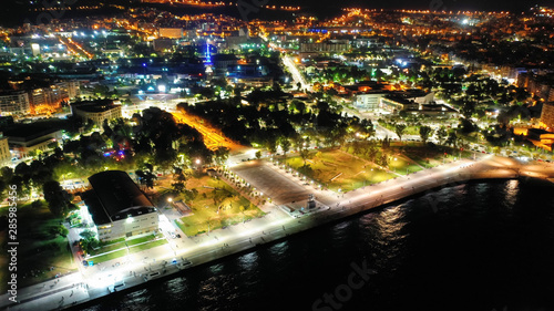 Aerial drone night shot of famous promenade area in new waterfront of Thessaloniki or Salonica featuring Alexander the Great statue  North Greece