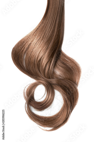 Long wavy brown hair on white background. Ponytail
