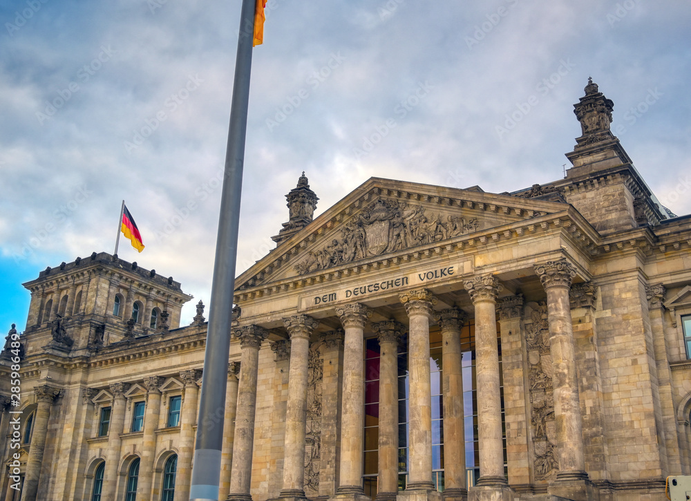 Obraz premium The Reichstag building located in Berlin, Germany which houses the German parliament, the Bundestag.