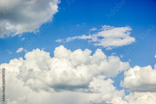 Blue sky and beautiful fluffy cloud. Best summer sky photo background.