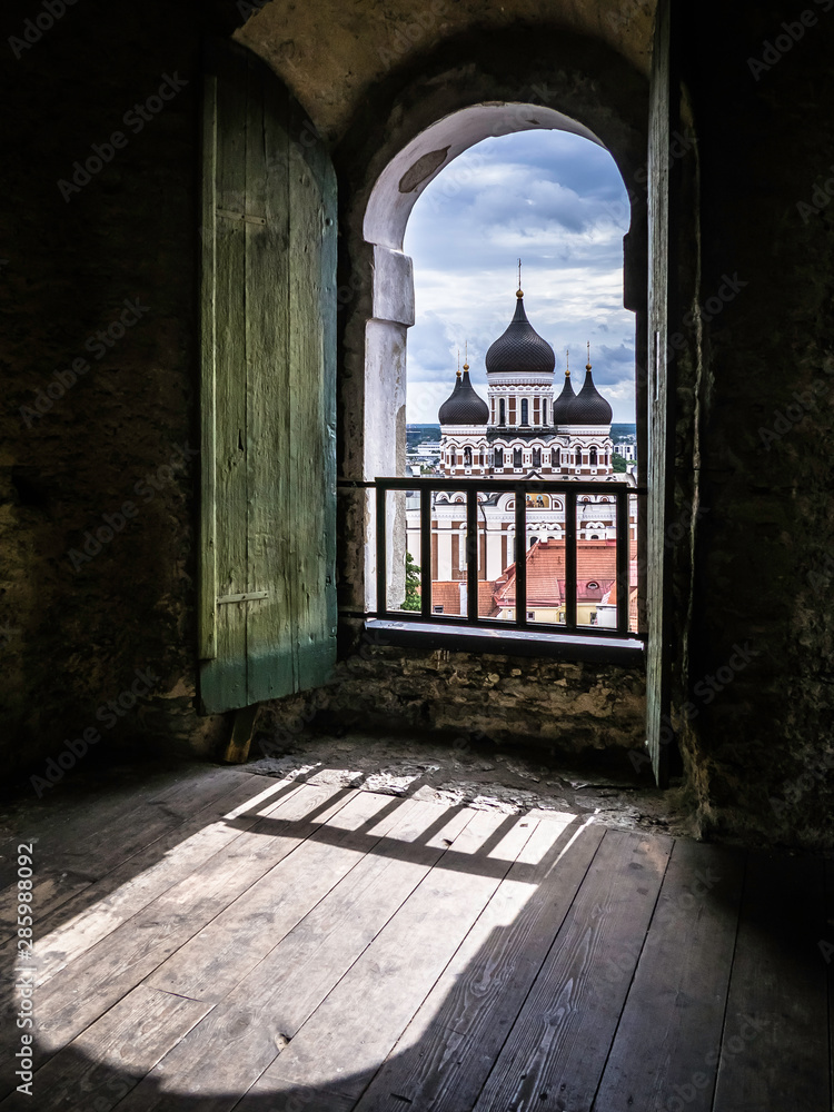 Beautiful Alexander Nevsky Cathedral in Tallinn through the window of St Mary's Cathedral bell tower