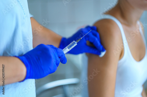 Vaccination a patient in hospital during an epidemic of influenza, measles. Flu shot, protection and prevention of viral infectious diseases