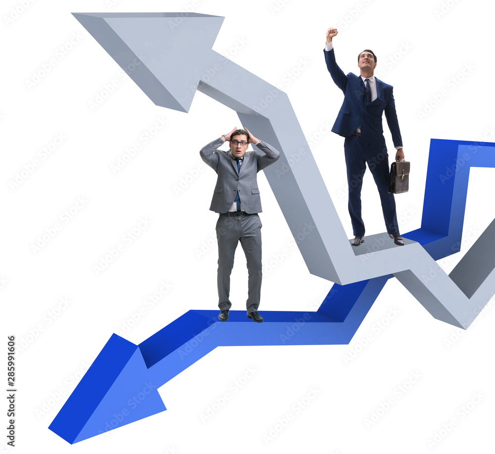 Businessman with charts of growth and decline Businessman with charts of growth and decline