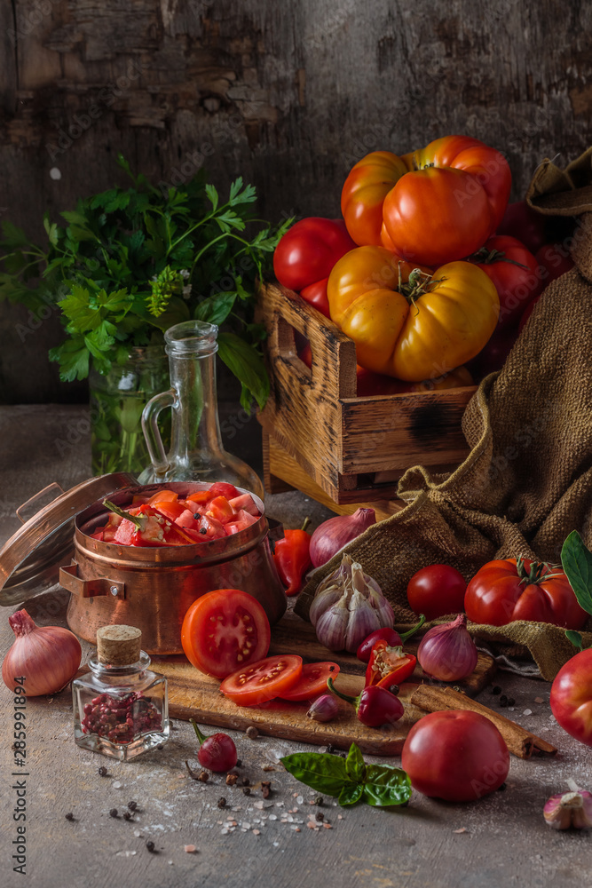 Sliced fresh tomatoes on cutting board, dark photo Sliced fresh tomatoes on cutting board, dark photo