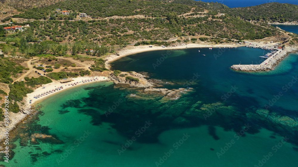 Aerial drone photo of famous village and long sandy beach of Sarti in South Sithonia, Halkidiki, Greece