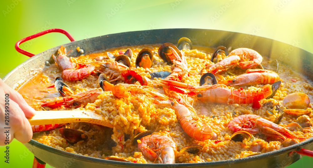 Paella. Traditional spanish food, seafood paella in the fry pan with mussels, king prawns, langoustine and squids Paella. Traditional spanish food, seafood paella in the fry pan with mussels, king prawns, langoustine and squids
