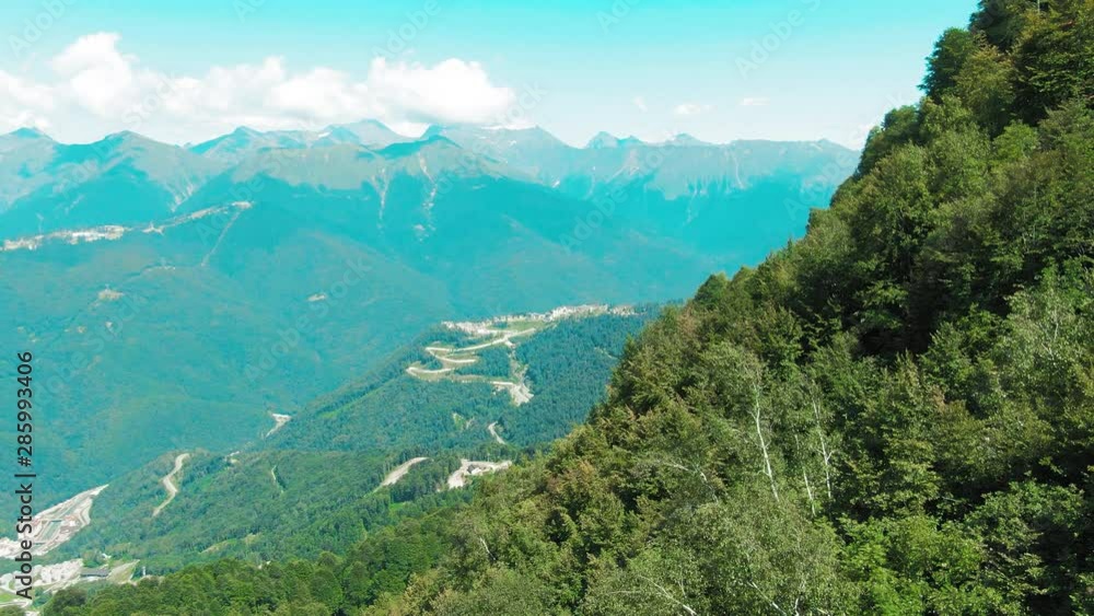 Aerial 4k view. Beautiful summer landscape of mountains and forest. Bird's-eye. Aerial 4k view. Beautiful summer landscape of mountains and forest. Bird's-eye.