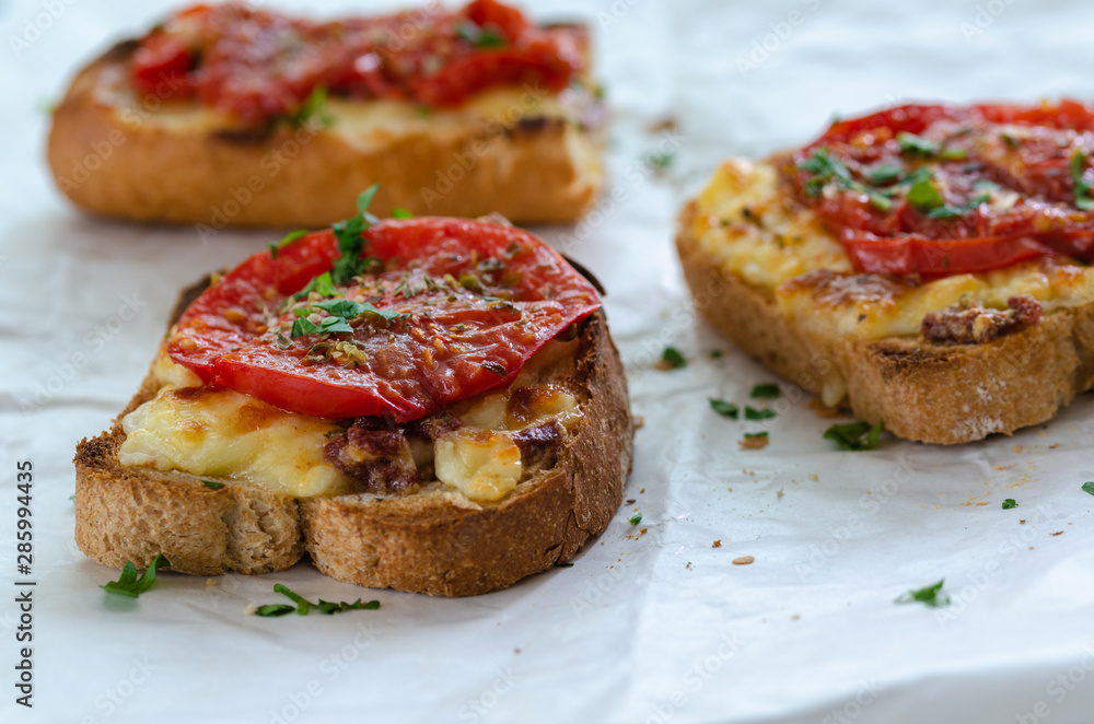 Healthy breakfast at home.Three slices of bread with cheese and tomato Healthy breakfast at home.Three slices of bread with cheese and tomato