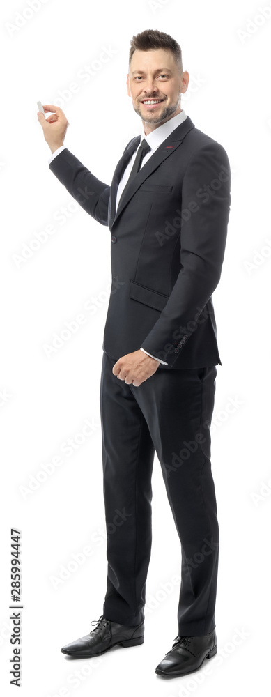 Handsome male teacher writing something against white background