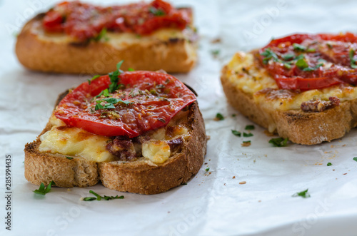 Healthy breakfast at home.Three slices of bread with cheese and tomato