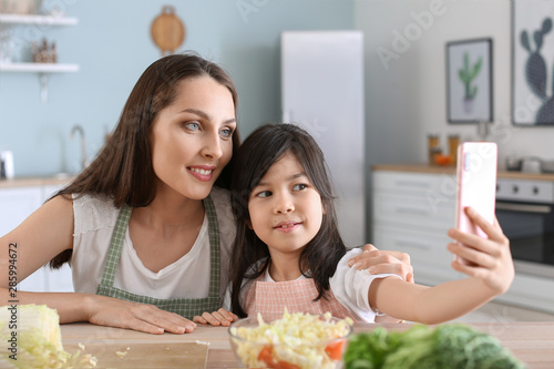Mother with cute daughter t...