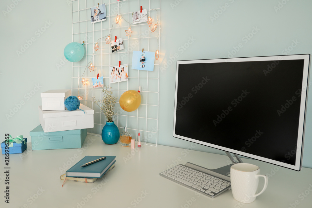 Workplace with mood board and computer in modern room Workplace with mood board and computer in modern room