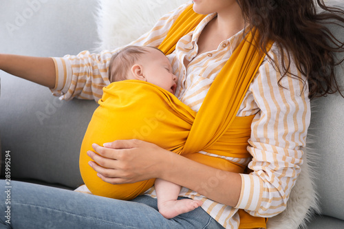 Young mother with little ba...