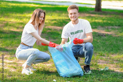 Volunteers gathering garbag...