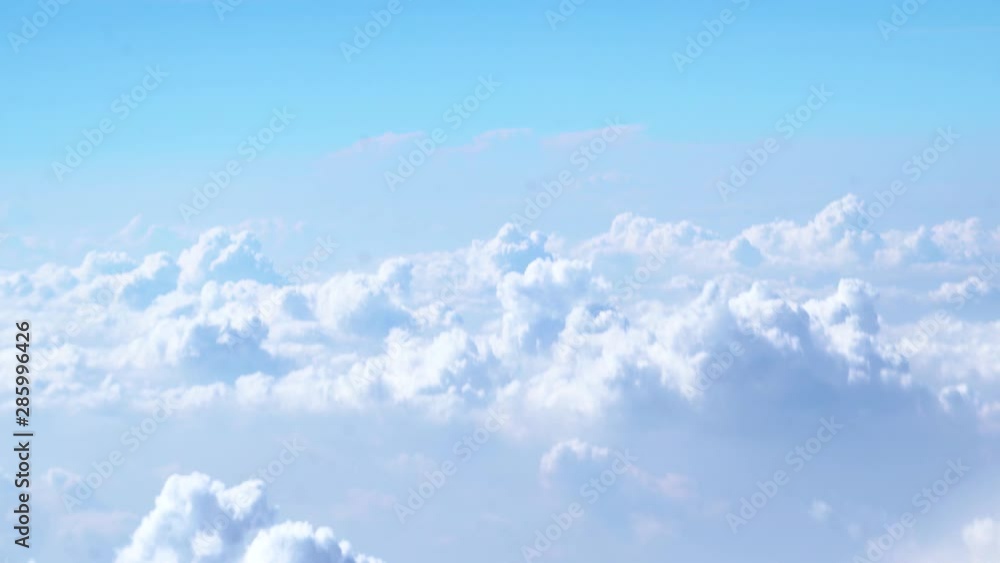 Beautiful white clouds in the blue sky in the morning through airplane view