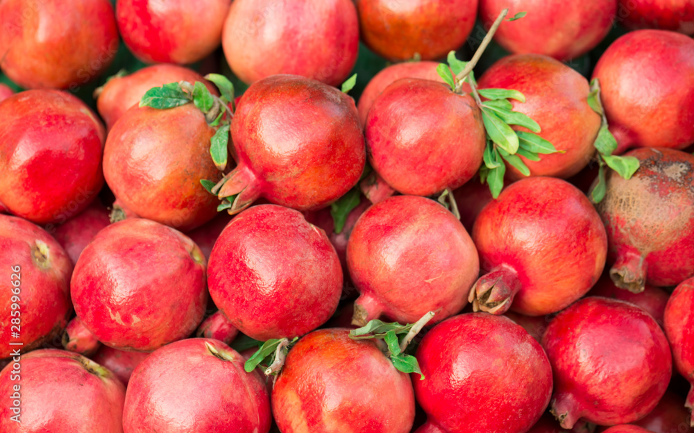 Ripe Pomegranates. Bright fruit background (Selective focus) Ripe Pomegranates. Bright fruit background (Selective focus)