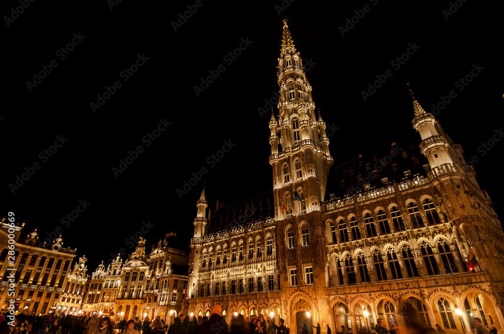 Beautiful night view at Grand-Place (Grote Markt). The central square of Brussels with the city's Town Hall. One of the most beautiful squares in the world. Brussels, Belgium Beautiful night view at Grand-Place (Grote Markt). The central square of Brussels with the city's Town Hall. One of the most beautiful squares in the world. Brussels, Belgium