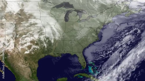 A weather map shows various storms passing the East Coast of the US. photo