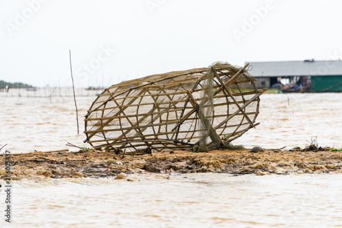 Fishing nets made from bamboo on the bank of the Siem Reap river, Cambodia photo