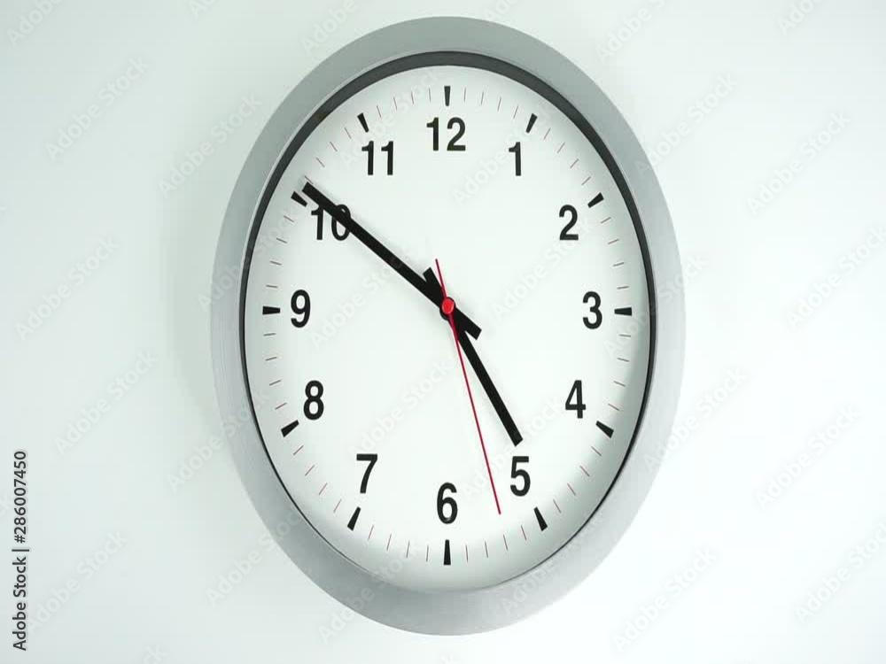 Closeup White wall clock face beginning of time 12.00 am or pm, Clock minute walk slowly, Time concept. Closeup White wall clock face beginning of time 12.00 am or pm, Clock minute walk slowly, Time concept.