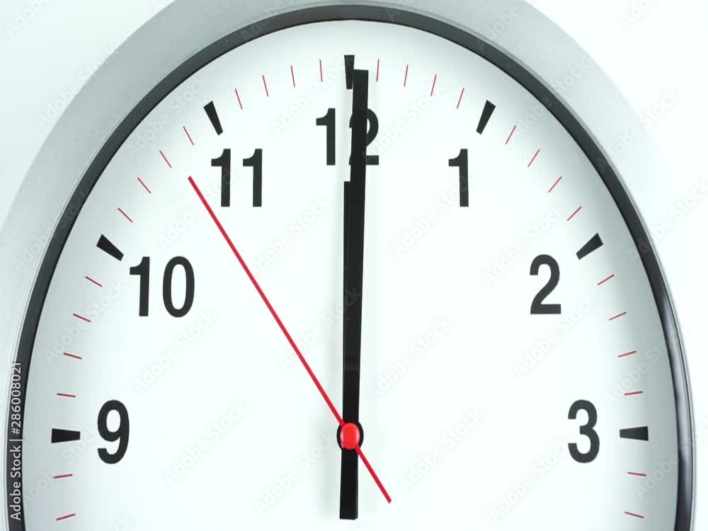 Closeup White wall clock, Black clock hands walk on white background, Time concept. Closeup White wall clock, Black clock hands walk on white background, Time concept.