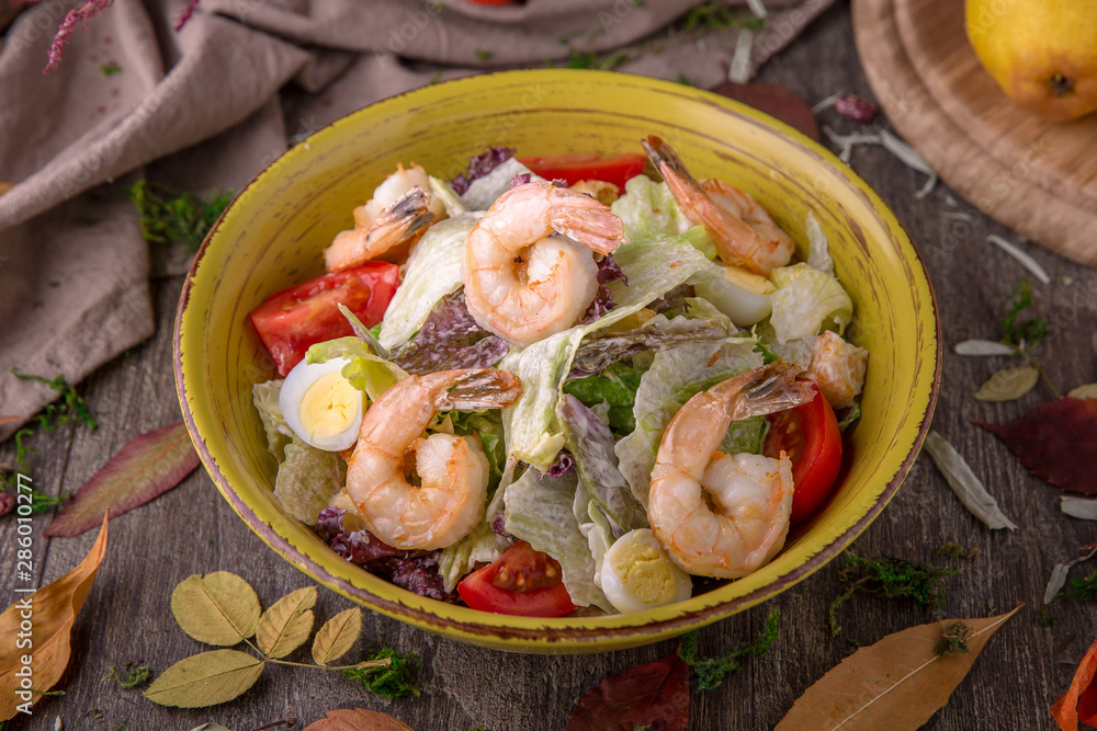 Salad of fresh vegetables, shrimps, quail eggs. Beautiful stylish menu. Autumn still life. Free space for text Salad of fresh vegetables, shrimps, quail eggs. Beautiful stylish menu. Autumn still life. Free space for text
