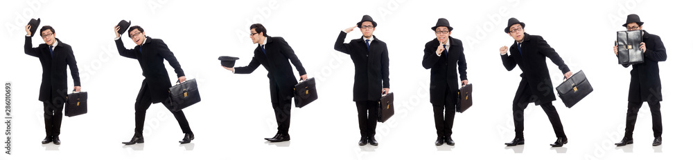 Young man holding suitcase isolated on white
