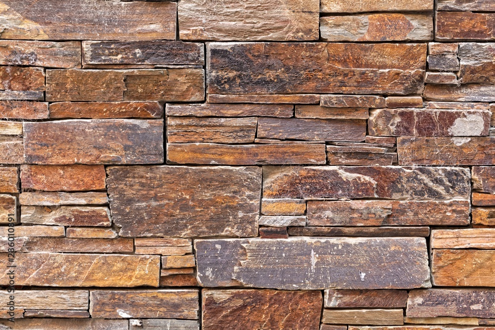 Fototapeta premium Surface of a dry wall made of slate.