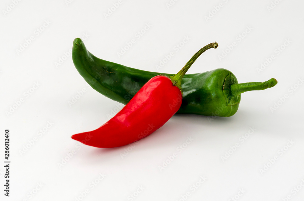 Red and green hot chili peppers isolated on white background, closeup