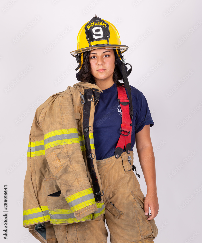 Female American firefighter in her gear Female American firefighter in her gear