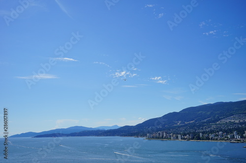 Beautiful Vancouver bay beach and mountain seen from Stanley park