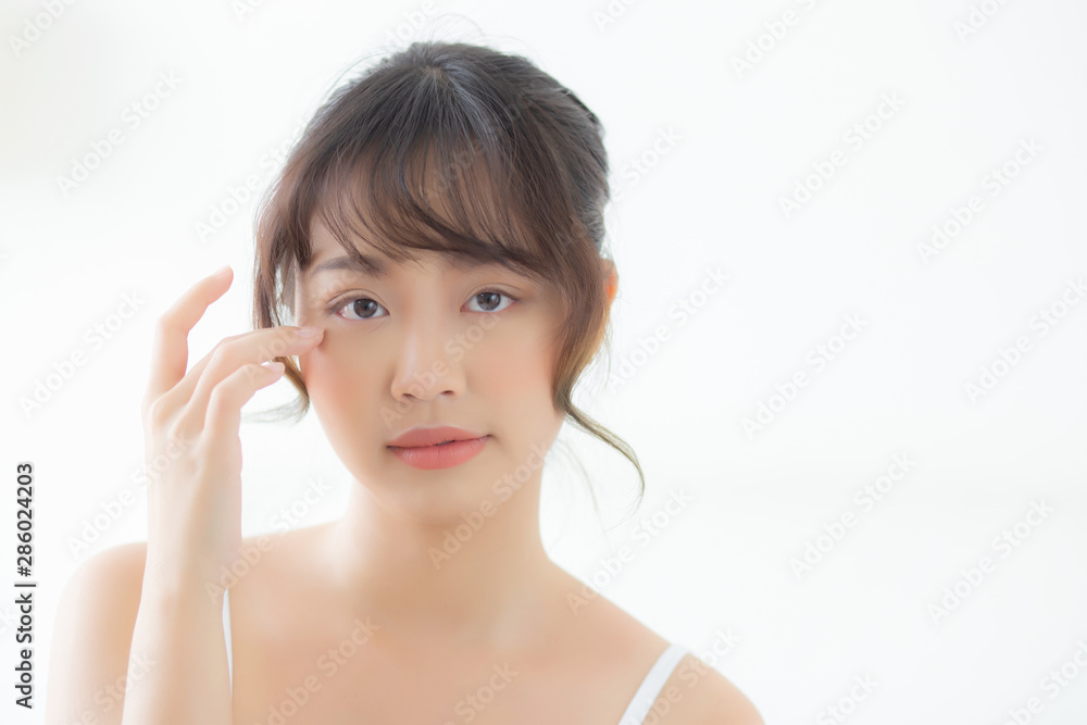 Portrait of beautiful young asian woman smile healthy and wellness at the bedroom, beauty asia girl skin care touch eye makeup and cosmetic with happy with fresh, lifestyle and relax concept. Portrait of beautiful young asian woman smile healthy and wellness at the bedroom, beauty asia girl skin care touch eye makeup and cosmetic with happy with fresh, lifestyle and relax concept.