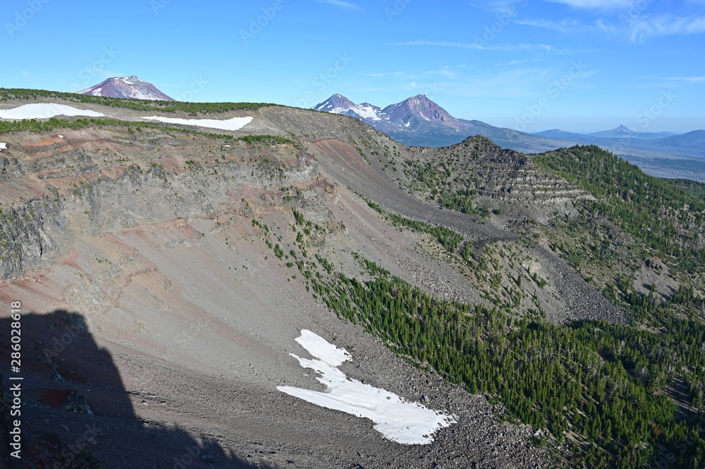 View of Three Sisters volcanoes from Tam McArthur Rim Trail in Three Sisters Wilderness near Sisters, Oregon on a clear summer morning.